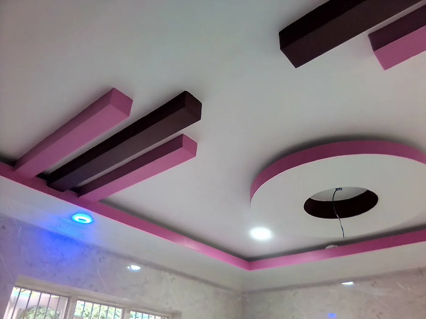 Ceiling with recessed white and blue lighting from the business Google listing